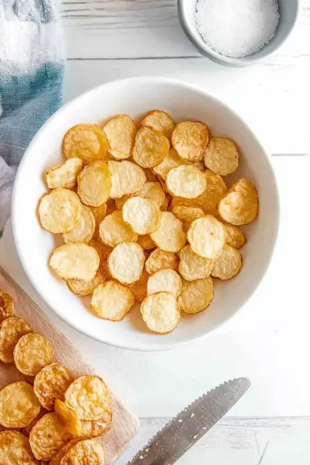 air fryer potato chips in a white bowl