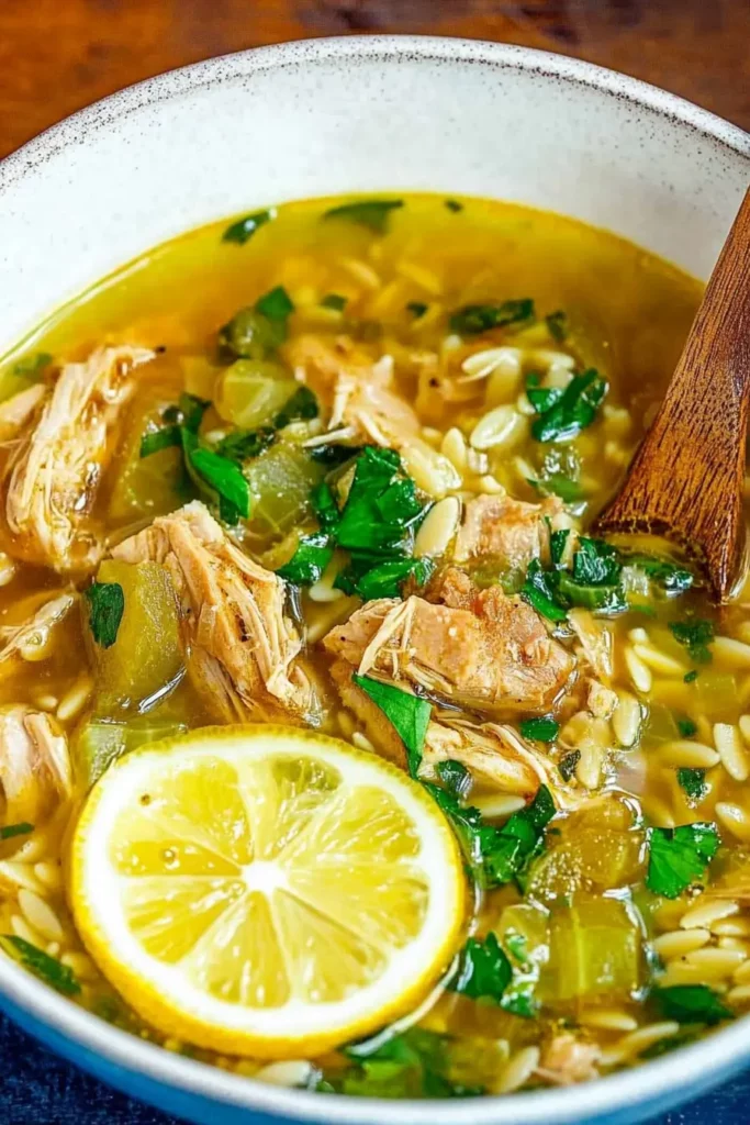 Chicken Vegetable Soup with Orzo: The Ultimate Cozy Dinner Recipe 5 Chicken Vegetable Soup with Orzo served in blue patterned bowls with fresh lemon wedges.