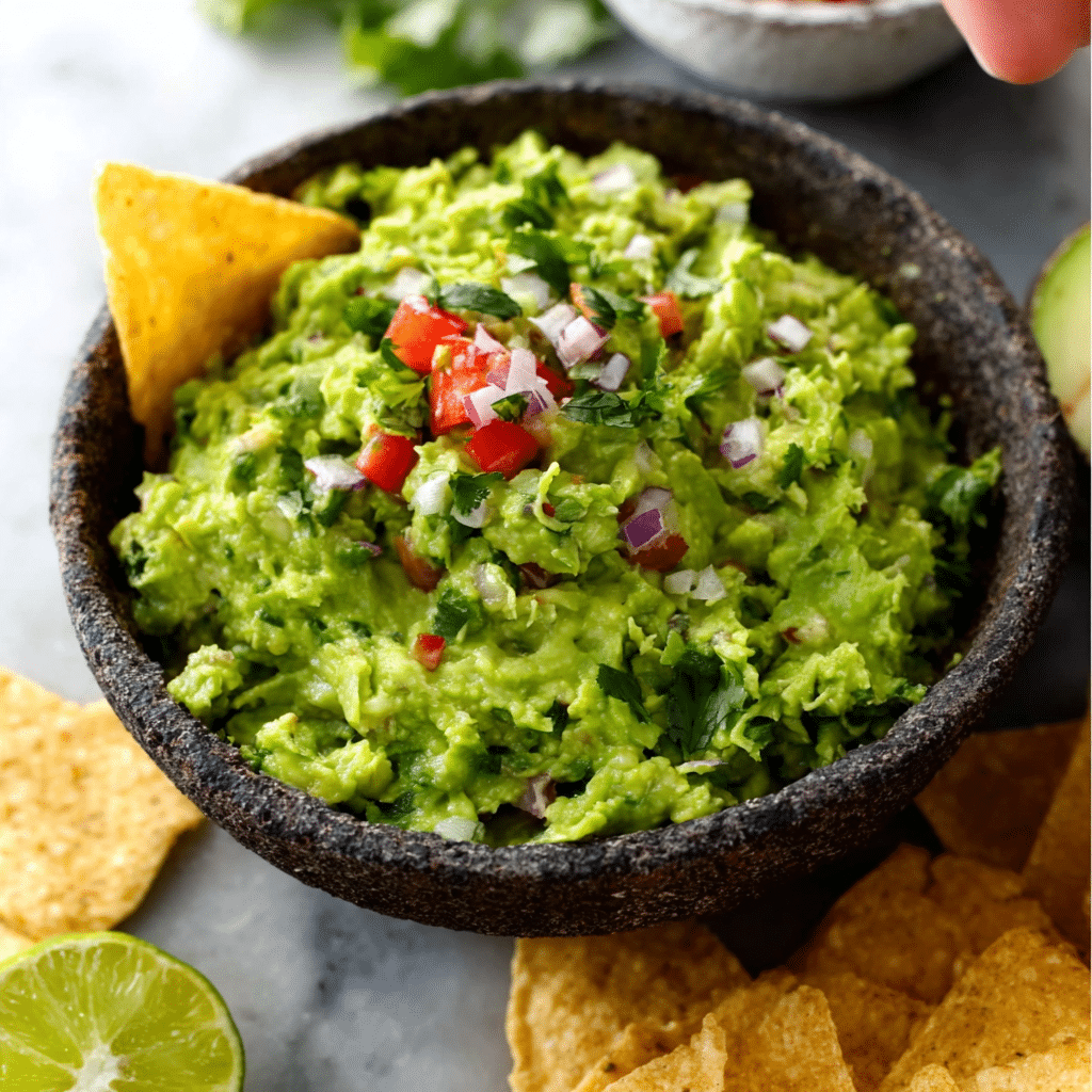 Guacamole with Pico de Gallo Recipe (Fresh, Quick & Full of Flavor) 1 Guacamole with Pico de Gallo and tortilla chip garnish